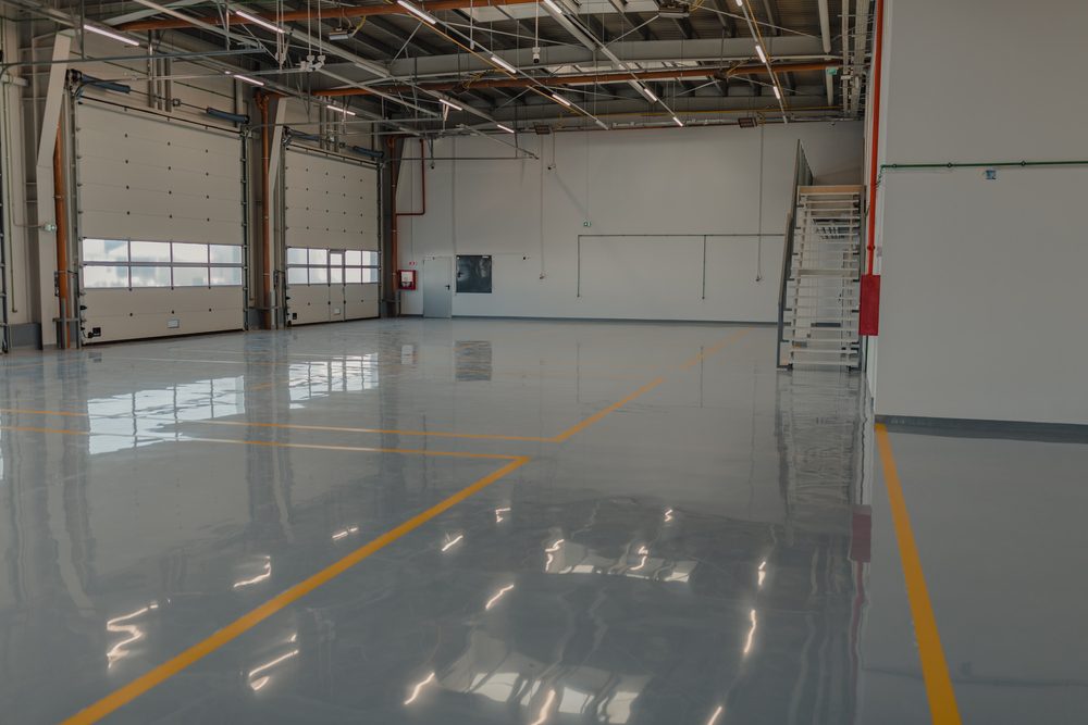 Shiny pokished and waxed concrete floors inside a garage.